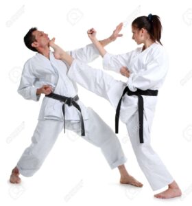 10217509-Karate-Young-girl-and-a-men-in-a-kimono-with-a-white-background-Battle-sports-capture-Stock-Photo